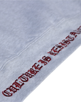 Close-up of Culture is Resistance red high-density direct embroidery on garment ribbing