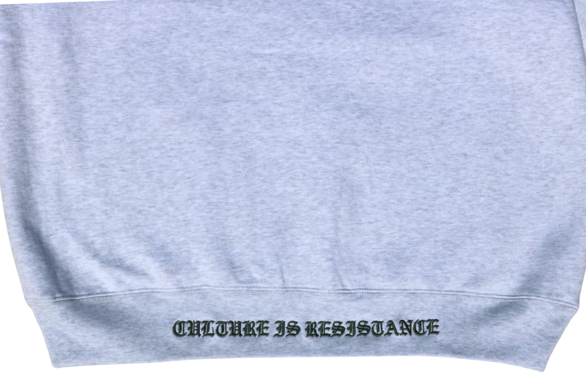 Detailed view of Culture is Resistance tonal embroidered waistband text