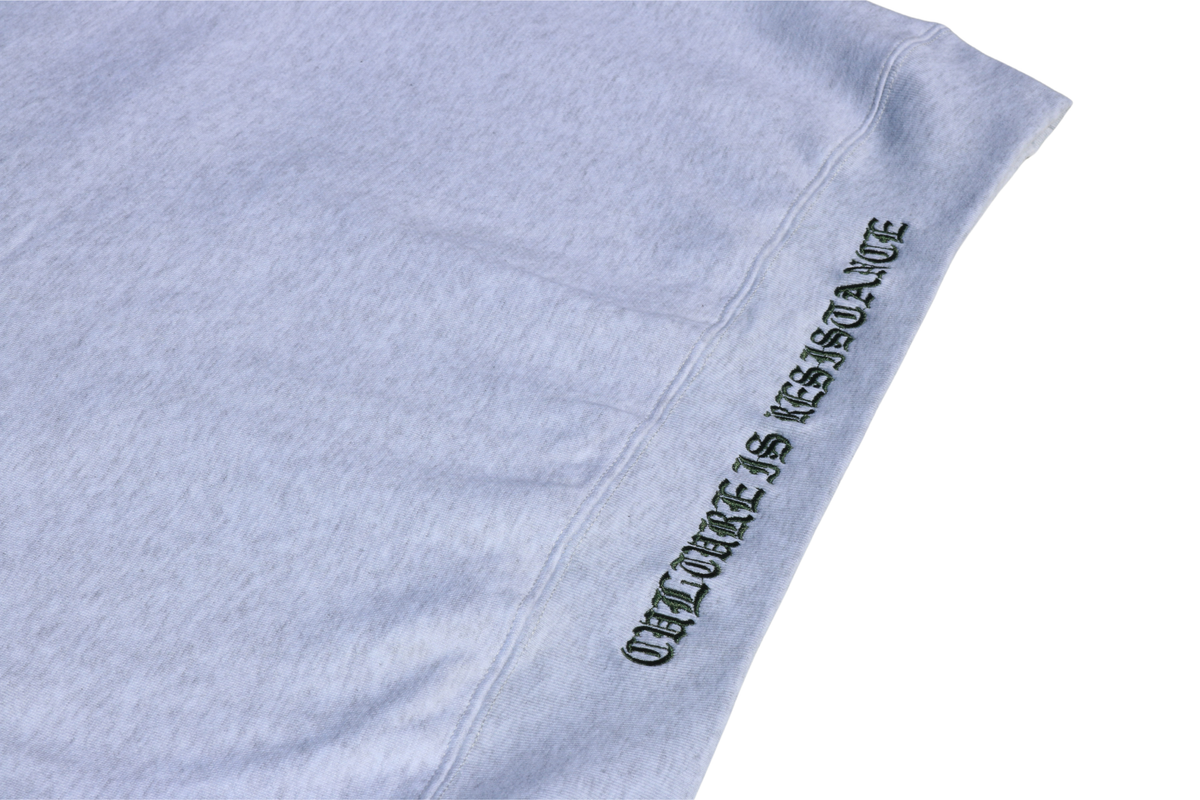 Close-up of Culture is Resistance red high-density direct embroidery on garment ribbing